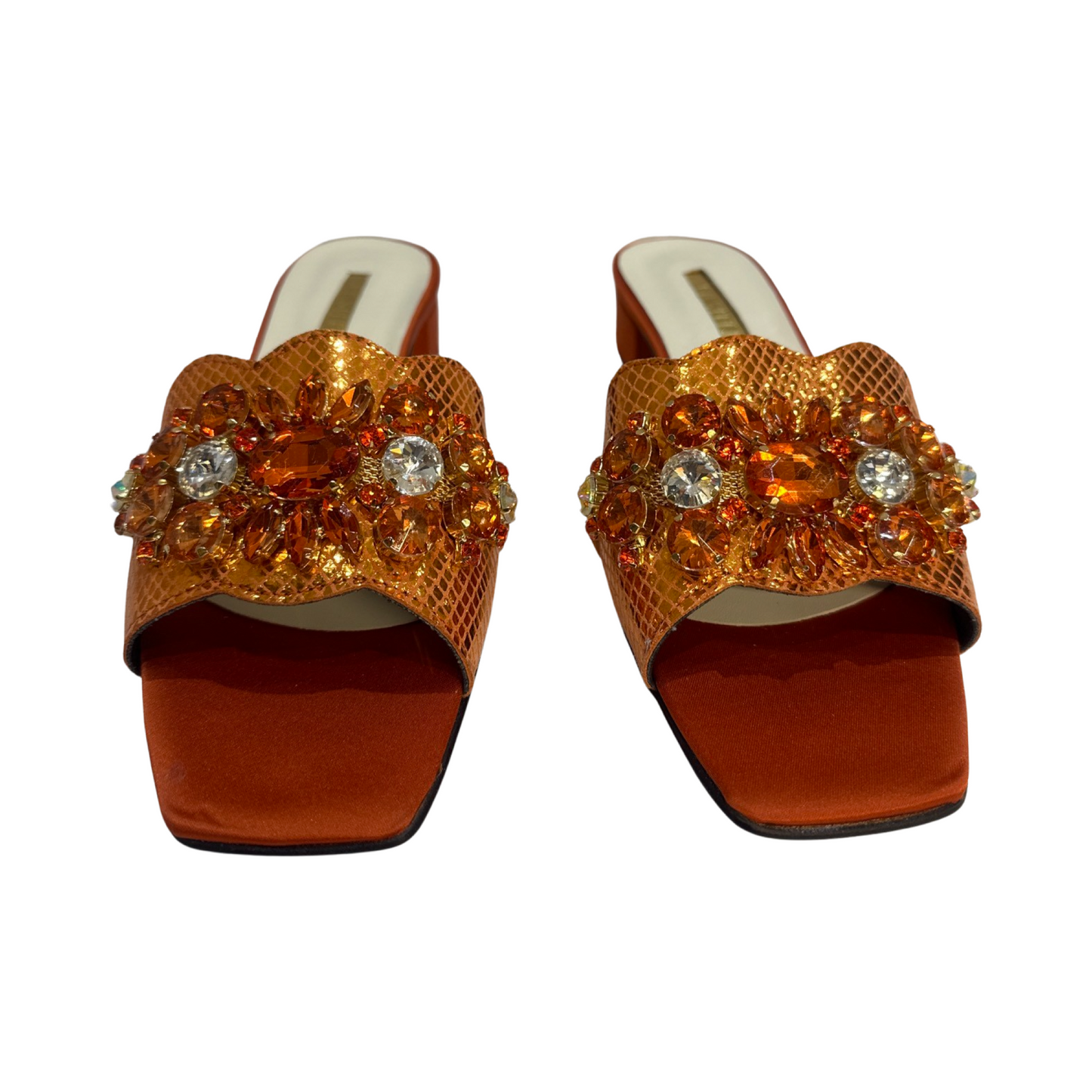Orange rhinestone flat mules with decorative strap, trendy summer footwear.