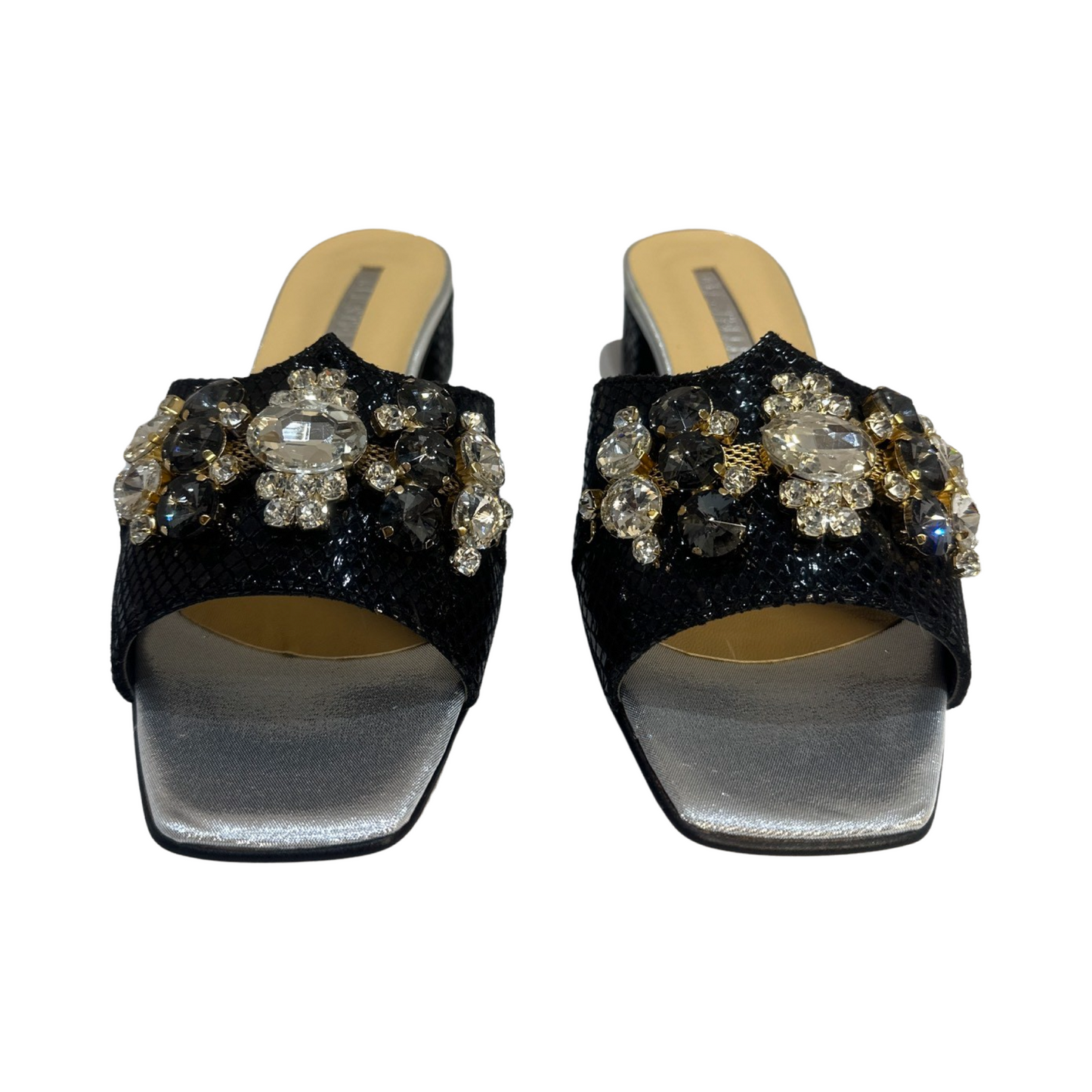 Trendy rhinestone flat mules with leather lining and fabric upper.