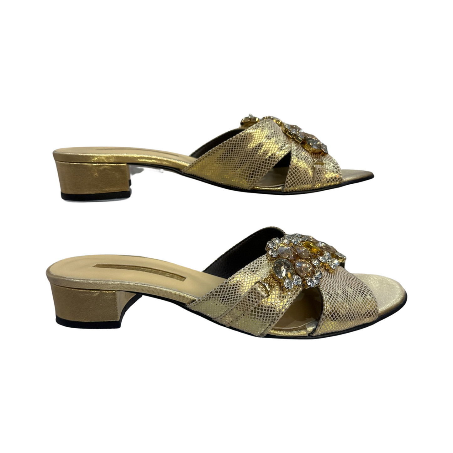 Rhinestone flat mules with gold embellishments and low heel.