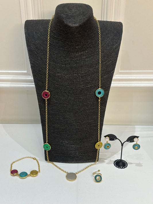 Full jewelry set on display with necklace, earrings, ring, bracelet