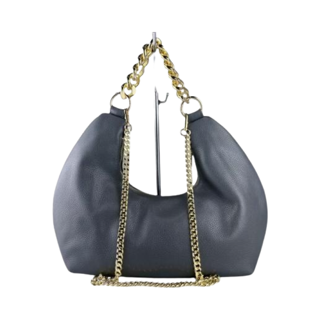 Tan leather tote bag featuring bold gold chain shoulder strap