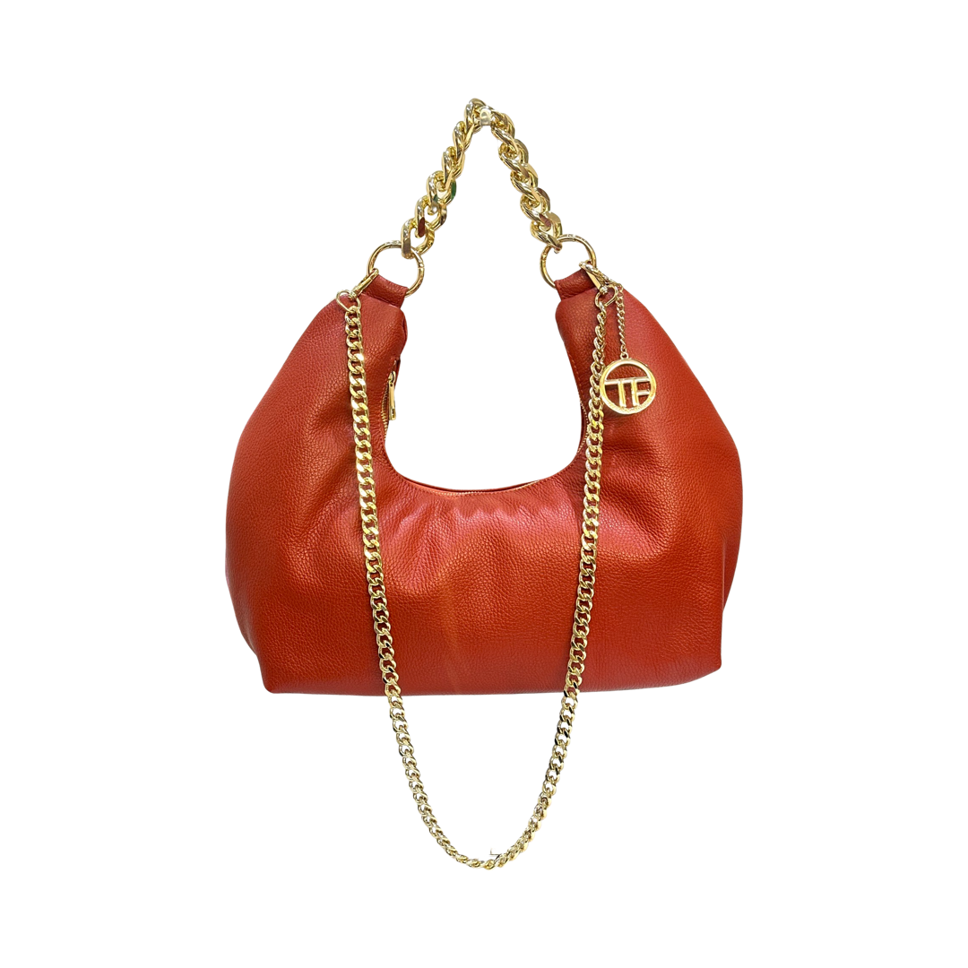 Orange leather tote with thick gold chain shoulder strap