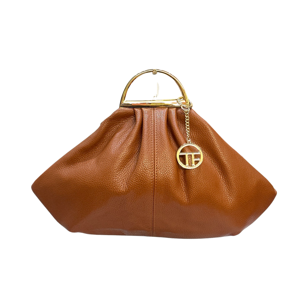 Leather tote bag with tassels, double handles, and adjustable shoulder strap.