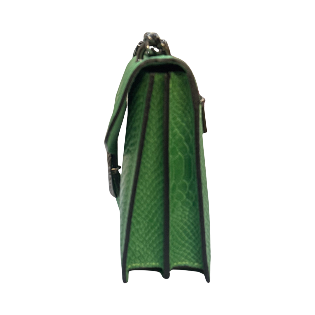 Leather Crossbody Bag with chain strap and double-headed tiger hardware, side view.