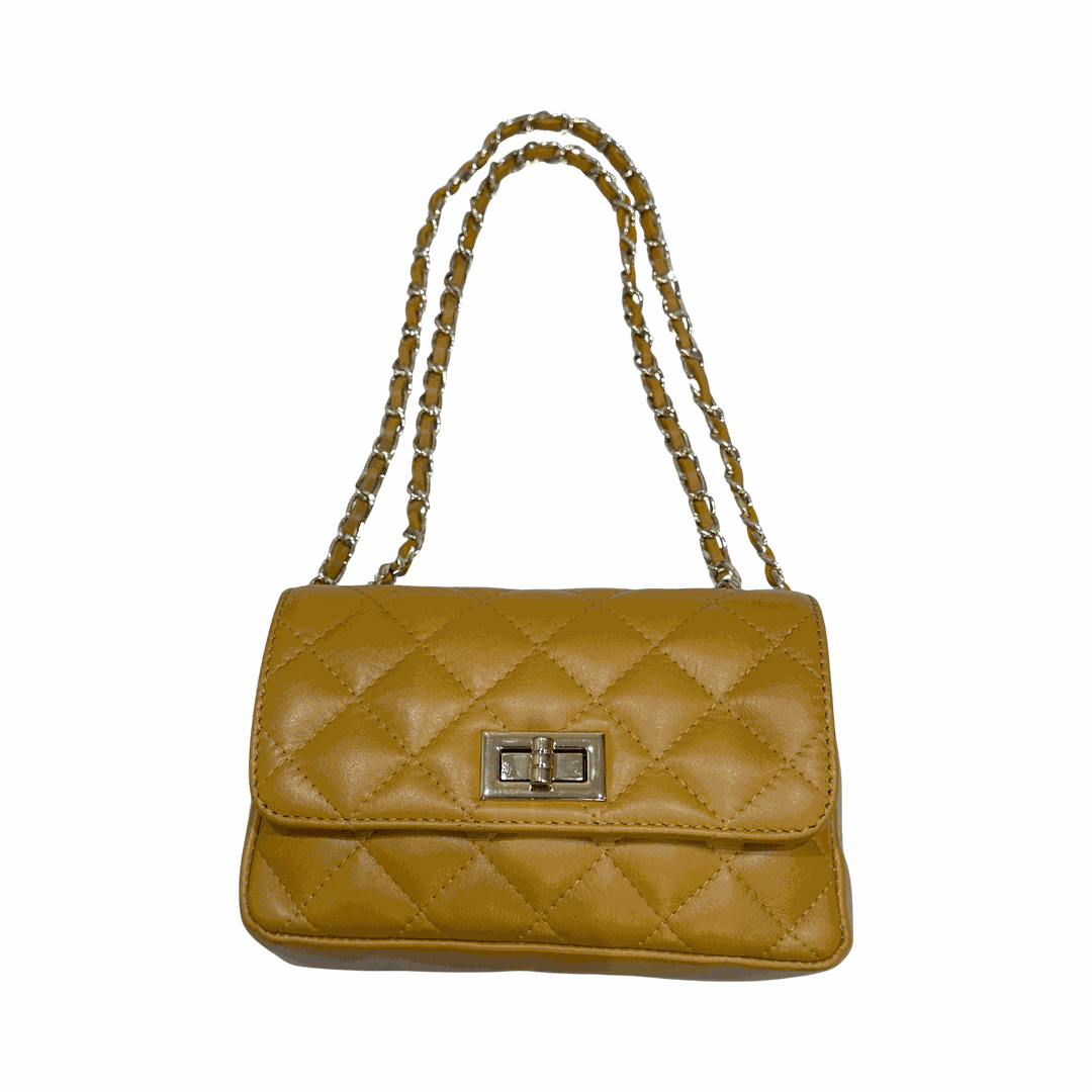 Quilted crossbody leather bag with turn lock closure and chain straps.