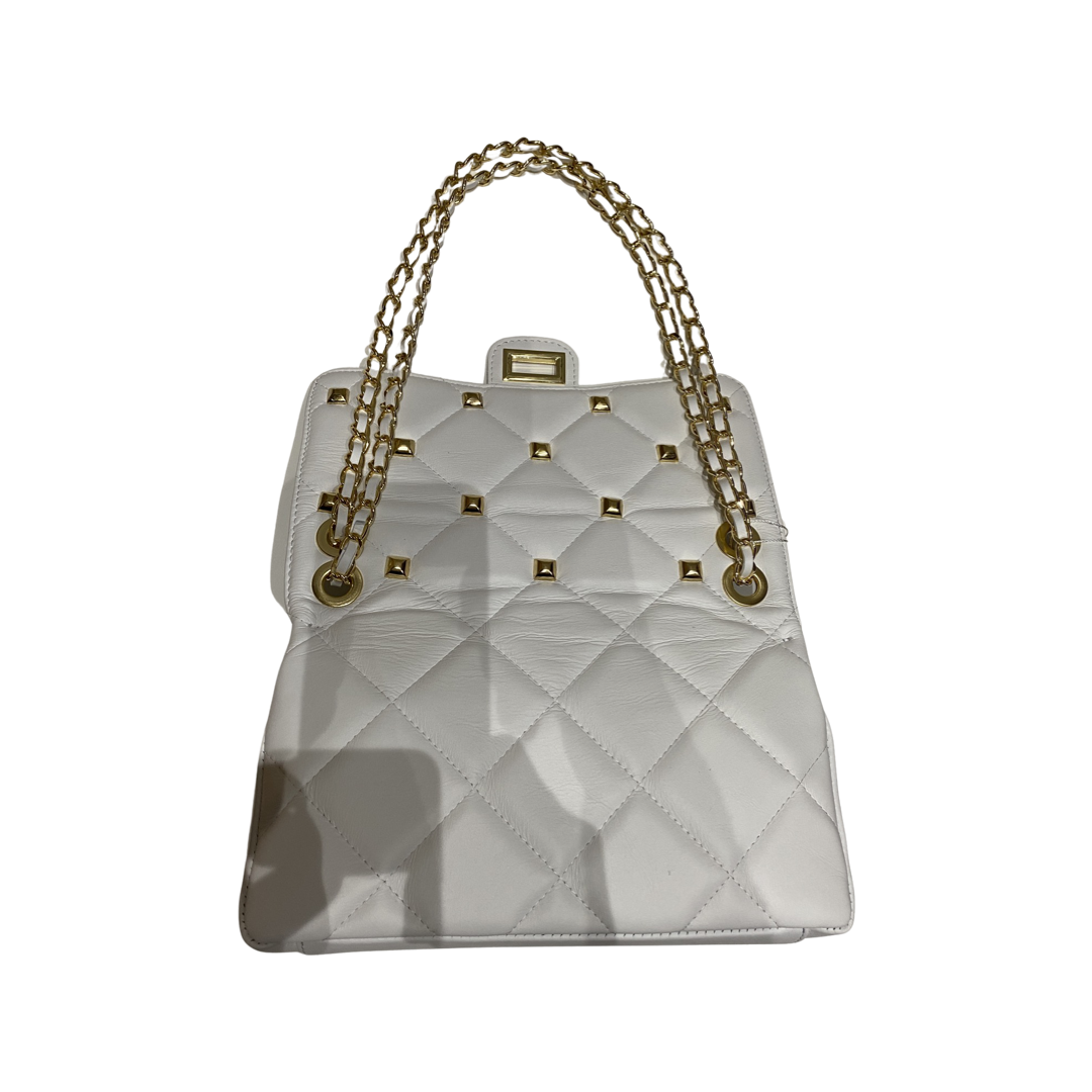Quilted crossbody leather bag with gold-tone chain strap and turn lock closure.