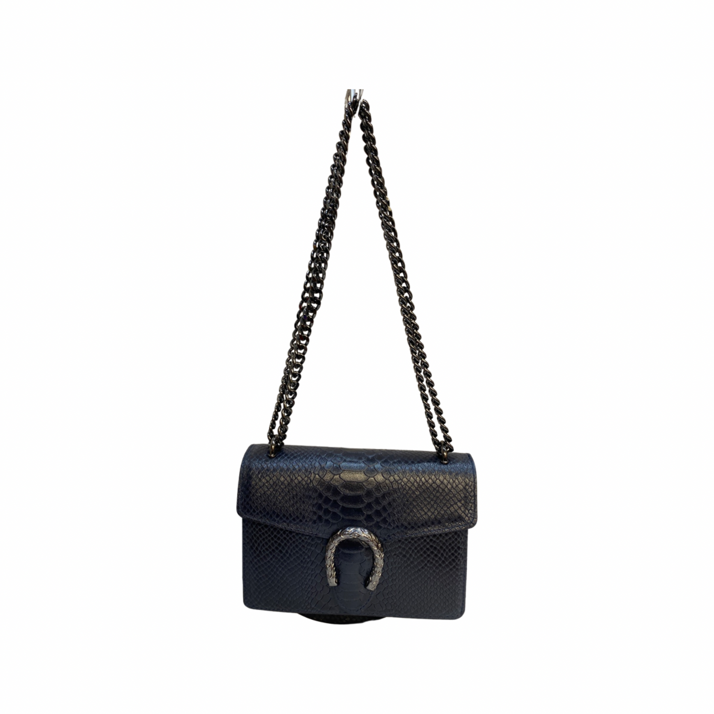 Crossbody leather bag with chain strap and tiger hardware.