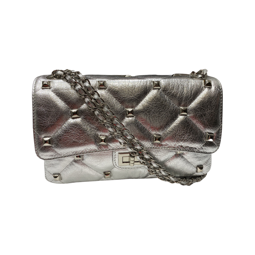 Quilted crossbody leather bag with chain strap and gold-tone hardware.