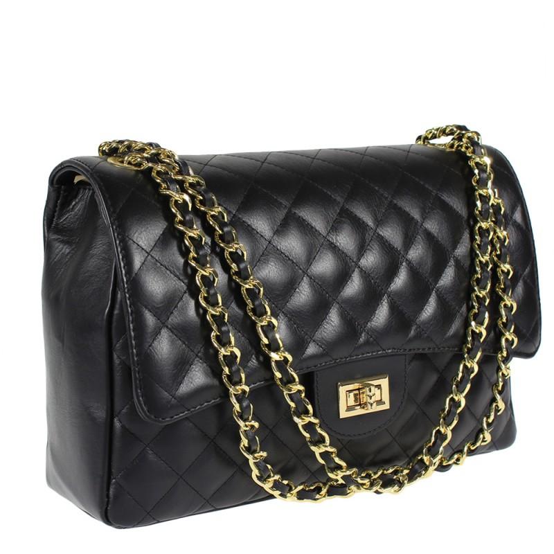 Quilted oversized chain shoulder bag with gold-tone chain strap and turn-lock closure.