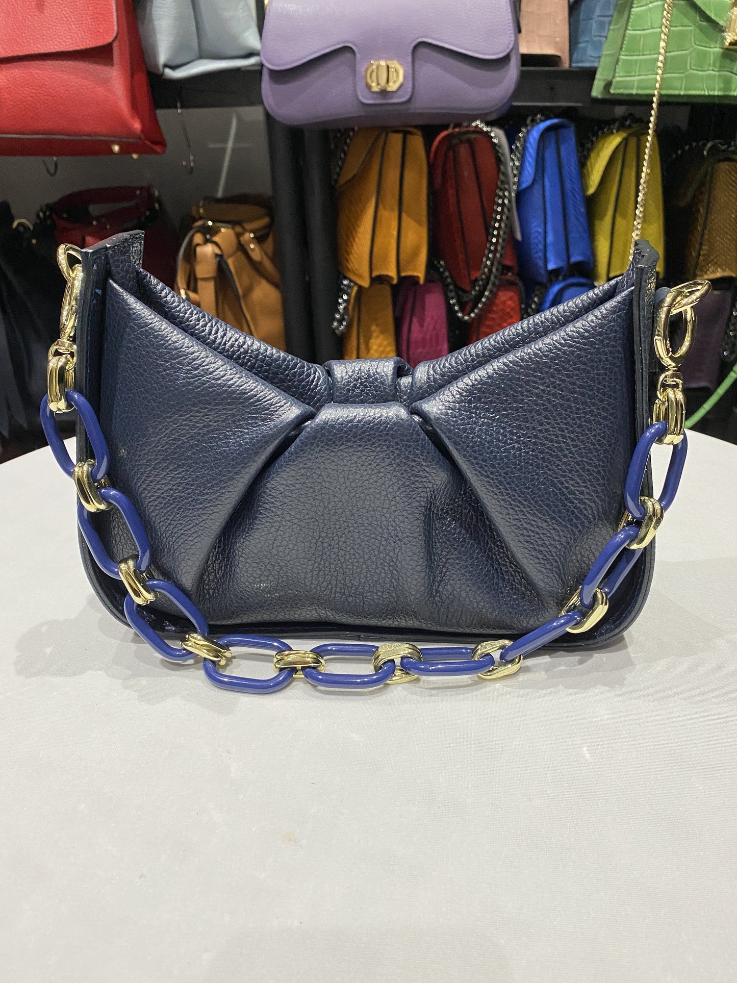 Small blue gathered tote bag in genuine Italian leather with chain strap.