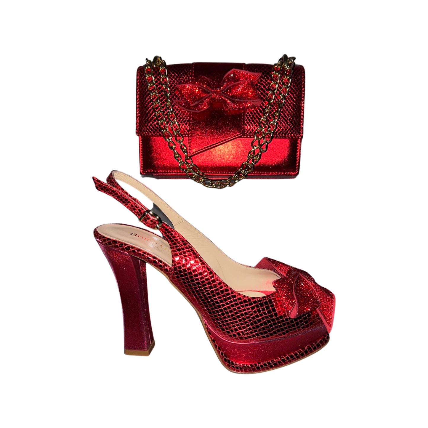 Red high-heeled shoes with matching rhinestone bag and chain strap.