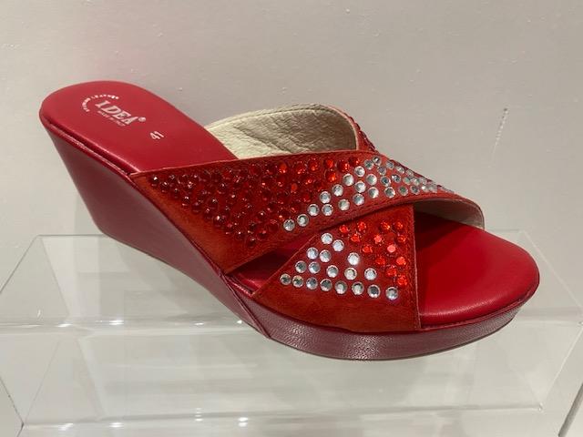 Red rhinestone suede leather platform wedge sandals with open toe design.
