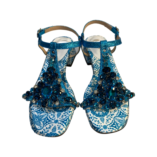 Turquoise blue rhinestone flat sandals with embellished design and round toe.
