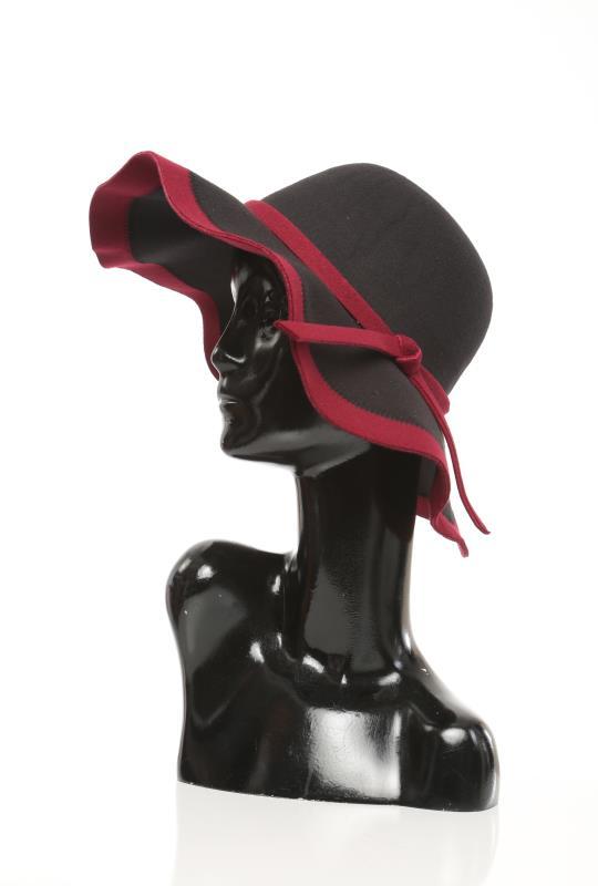 Women floppy hat in black with red trim, elegant fashion accessory.