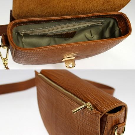 Small leather clutch bag with magnetic flap closure, adjustable strap, and gold metal details, featuring an inner zip and fabric interior.