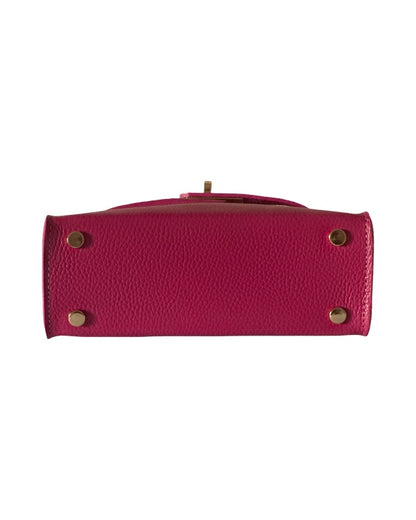 Base of pink leather handbag with four gold-tone protective feet