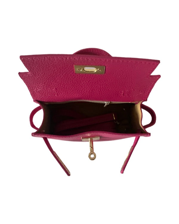 Open pink leather mini handbag showing interior and shoulder strap