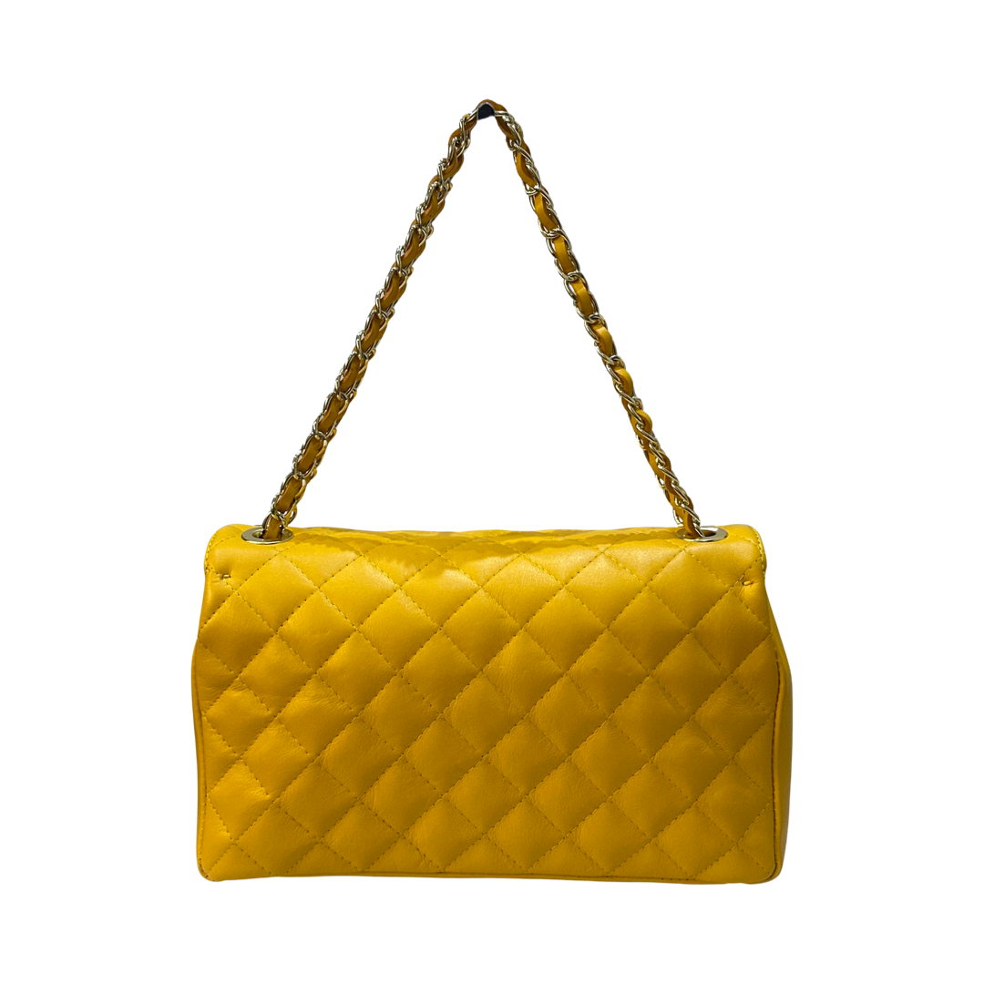 Yellow quilted chain shoulder bag with gold-tone strap and diamond-stitched design.