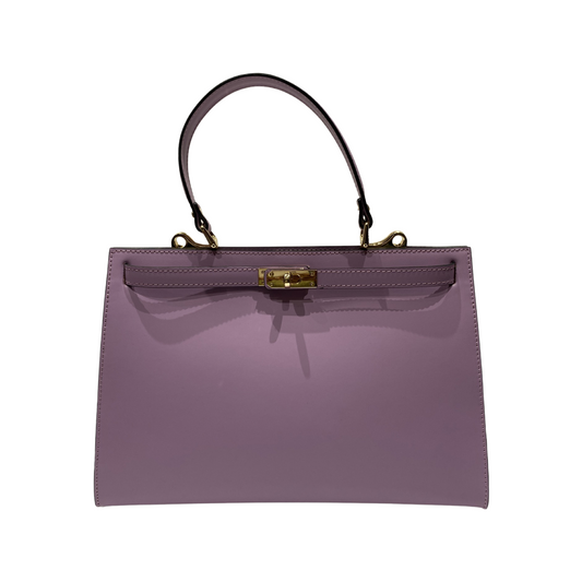 Oversized handheld leather tote bag with top handle and gold metal details.
