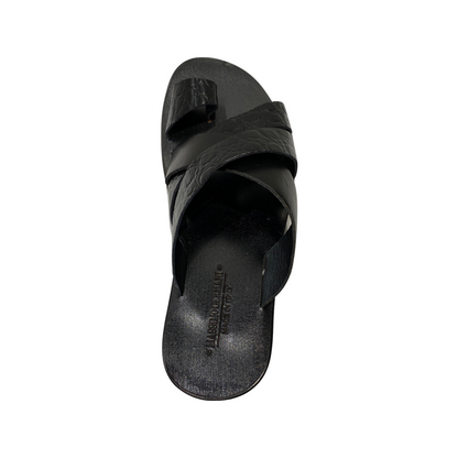 Men's black cross strap leather sandals with padded insole and rubber sole.