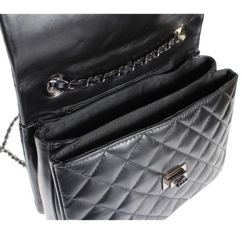 Quilted crossbody leather bag with metallic hardware and chain strap.