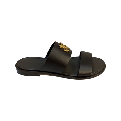 Brown 2 strap slip-on leather sandals with gold logo detailing, round toe, and handcrafted design from Giampiero and Nicola Vico.